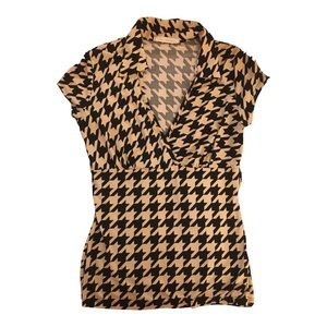 Womens V cut dress top. Is black & tan with asymmetrical design. Size large.